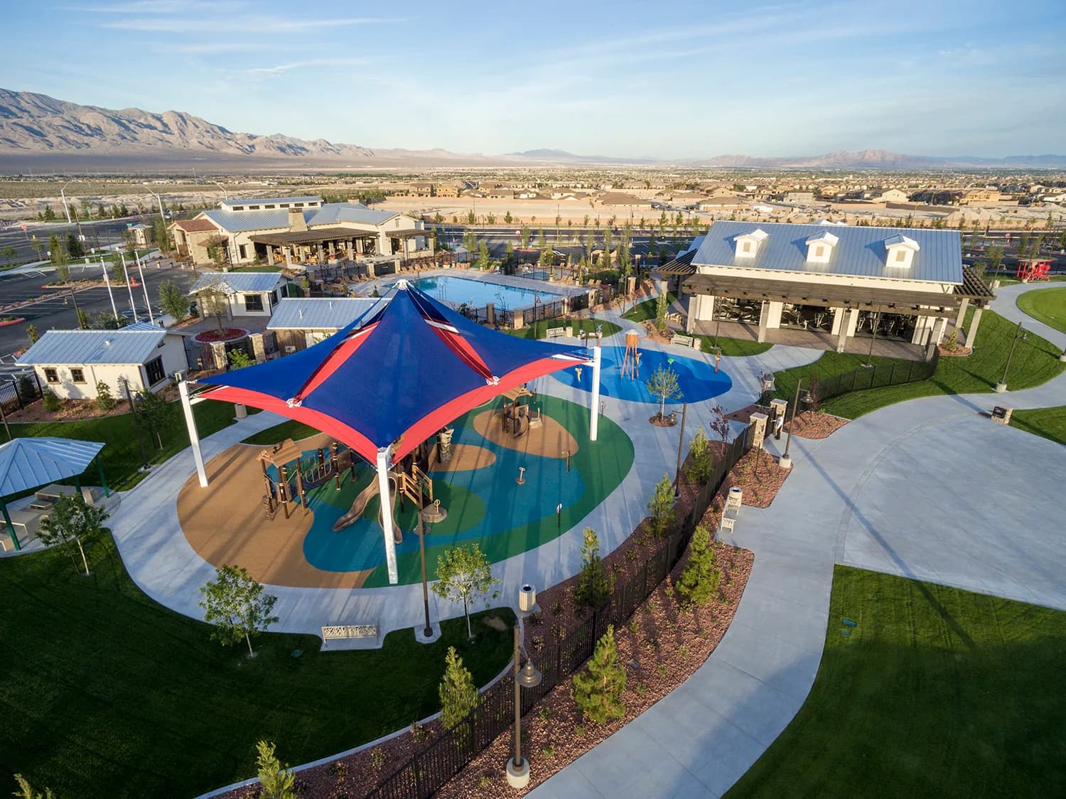 Aerial view of the Skye Canyon community center, showing the pool, splash pad, fitness pavilion and surrounding neighborhood.